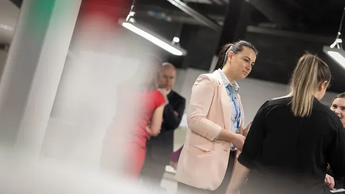 a student talking to two people