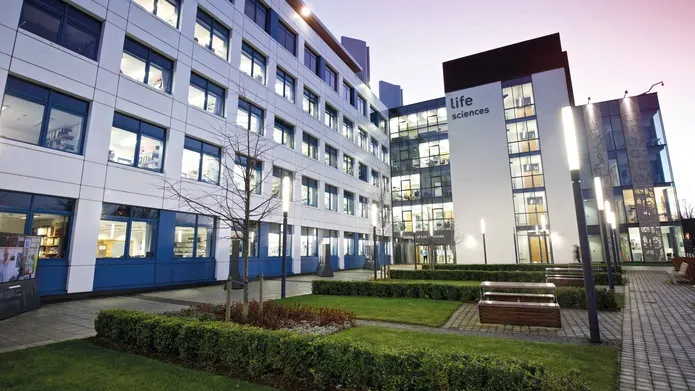 Photo of the Discovery Building at dusk