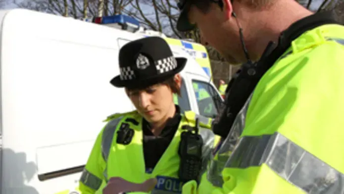 Police officer in high-visibility jacket