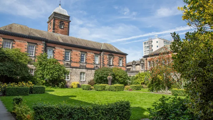 Red brick building with a little clock tower