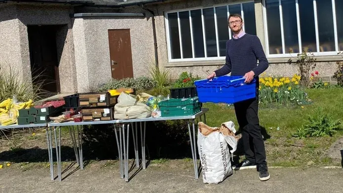 Neil Campbell organising food larder