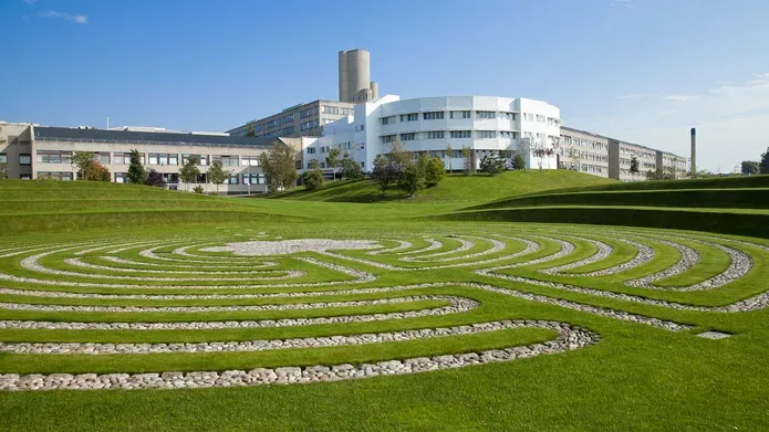 white building behind green grass