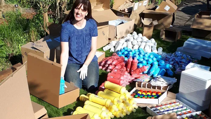 Vicky Armstrong packing boxes of art supplies