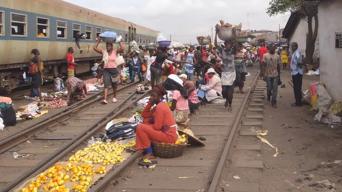 People selling goods at a railway station in Africa
