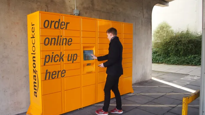 yellow lockers with a person collecting a parcel
