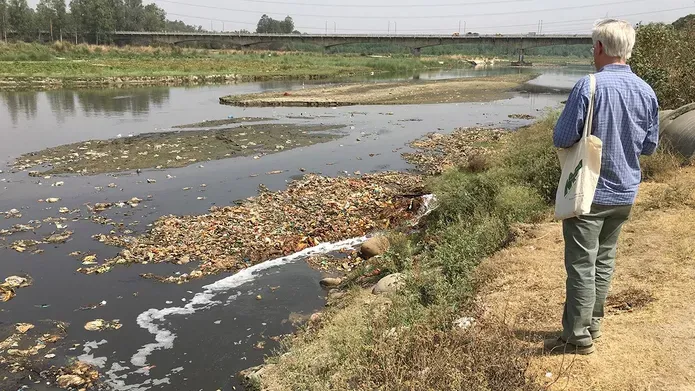 Man looking out over the Ganges river