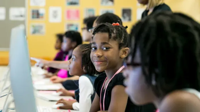 black girls at computers learning to code