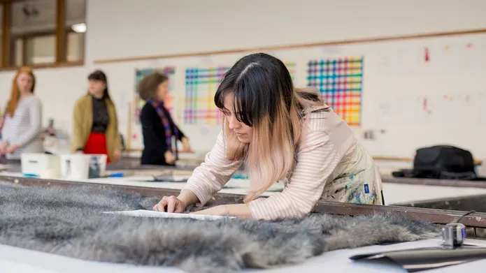 Student working on textiles