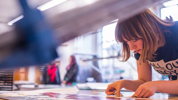 student using the printmaking facilities