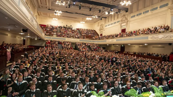 graduates sitting inside the Caird Hall