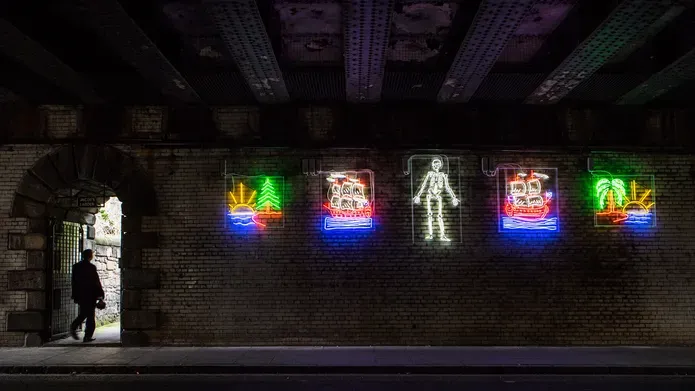 neon images on a wall
