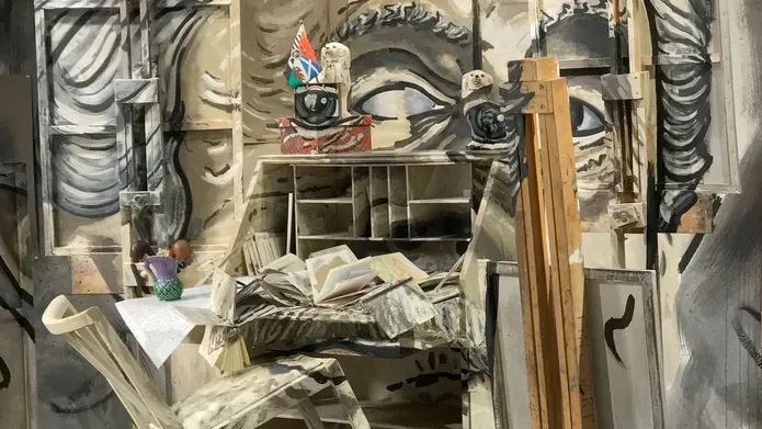 portrait of a man with a desk coming out of his face