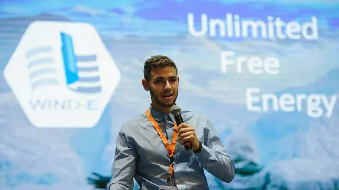 Photo of Harris-Angeli speaking at a conference