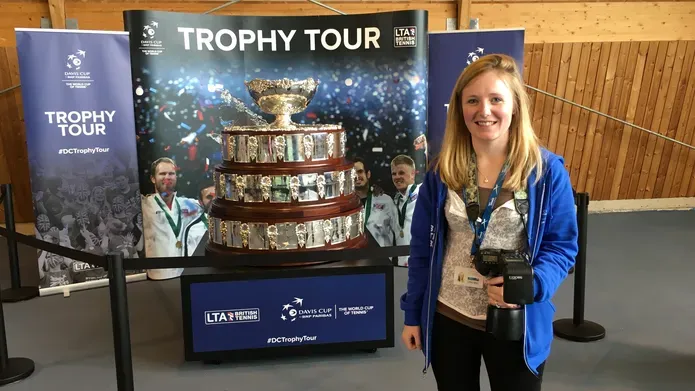 Sarah beside the Davis Cup Trophy