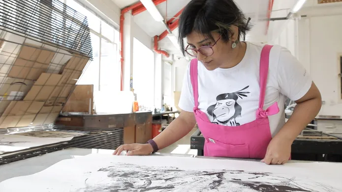 Dhira Chakraborty looking over her work