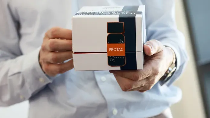 Researcher holding PROTAC box