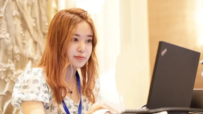 Crystal Tao using a laptop