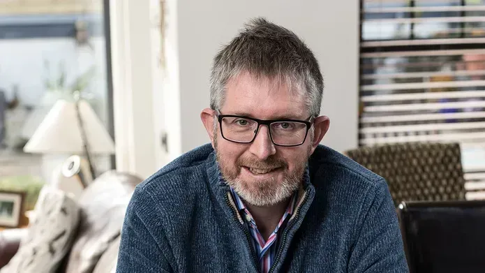 Grant McIntyre poses with his book
