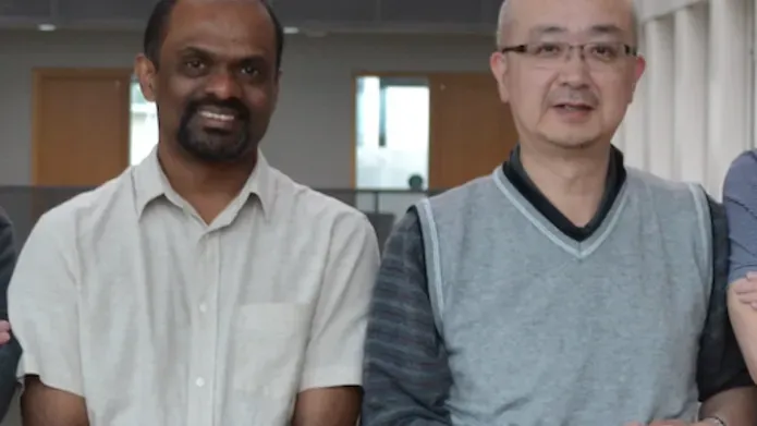 two male scientists standing together