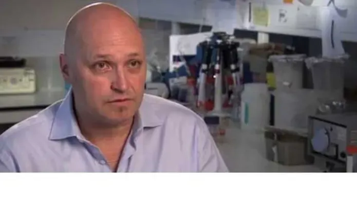 portrait of Robbie Waugh in plant sciences lab