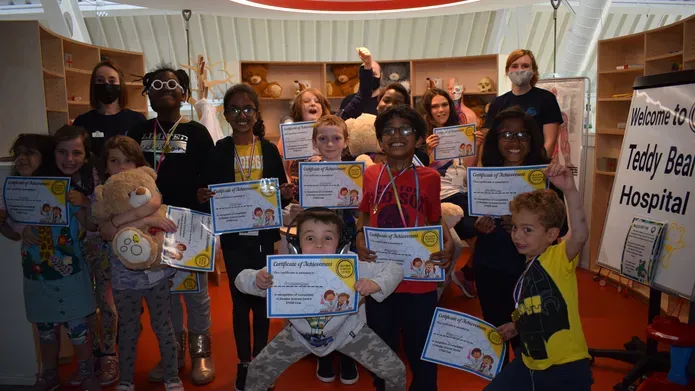 group of children holding certificates