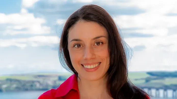 portrait of Virginia de Cesare with a background of river and hills
