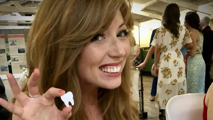 Gemma Gaw holding a model tooth