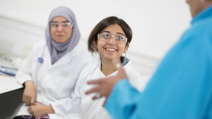 students in lab coats 
