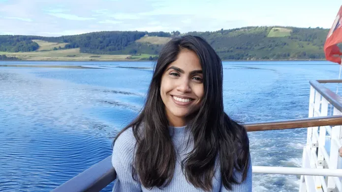 Young student Aanchal relaxing on a boat