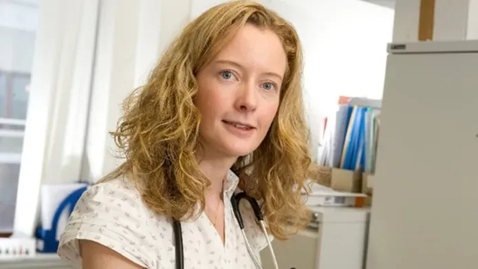 Professor Isla Mackenzie faces the camera in her office