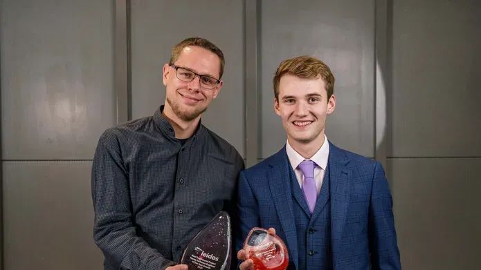 Ryan Anderson (right) with his Best Engineering Award standing with another win on his left