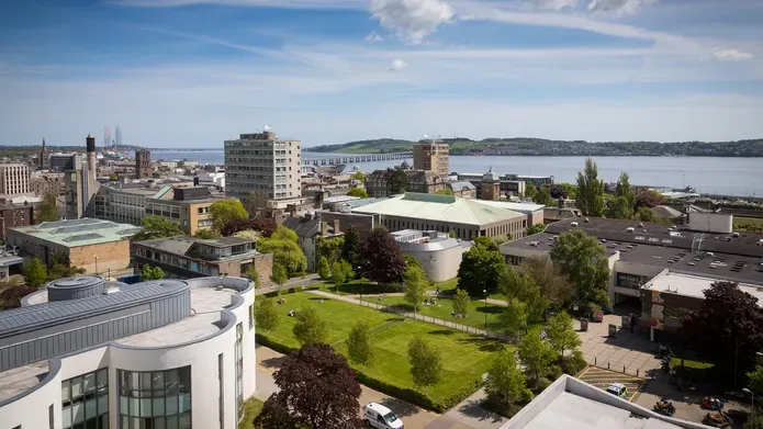 Campus green showing several of the city campus buildings