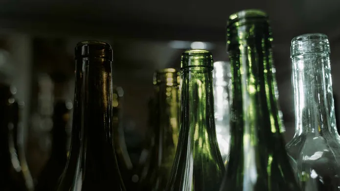 A close shot of a number of glass bottles