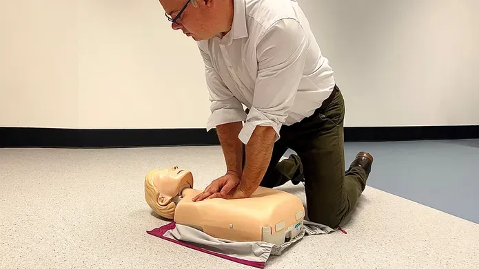 Dr Kevin Stirling, from the University's School of Health Sciences, demonstrating CPR on a teaching manikin