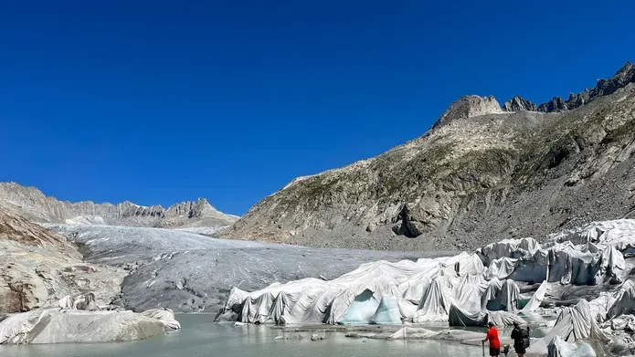 Dr Simon Cook  observing the front of a rapidly retreating glacier, Rhone, Switzerland, 2022