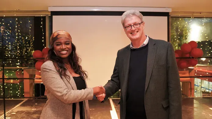 President of DUSA and Blair Grubb shaking hands