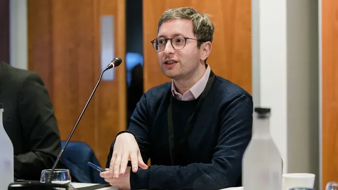 A person speaking at the conference.