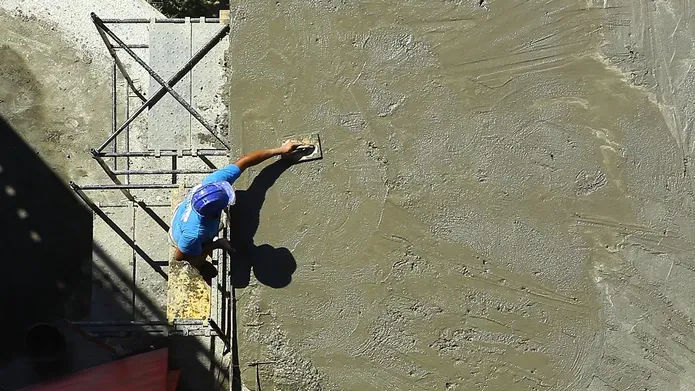 Man laying concrete