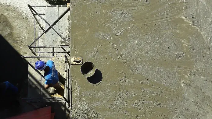 Builder next to cement