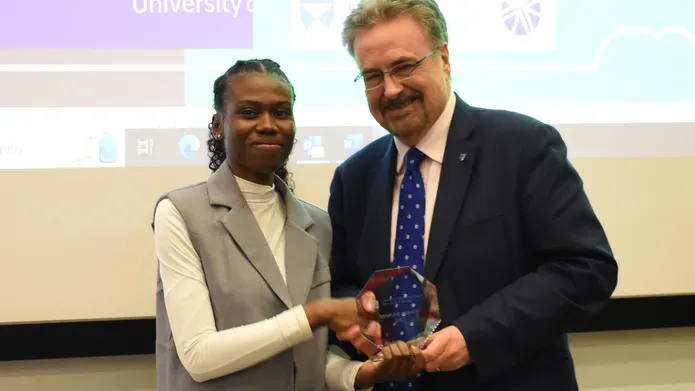 Lydia Konduah, winner of the School of Science and Engineering Award, being presented with a trophy at the venture final