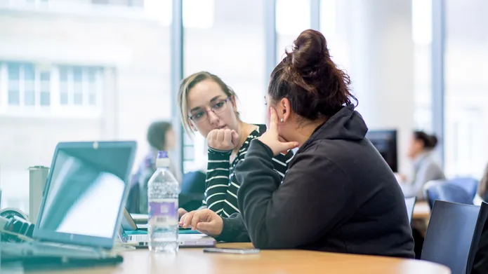 Two students in library
