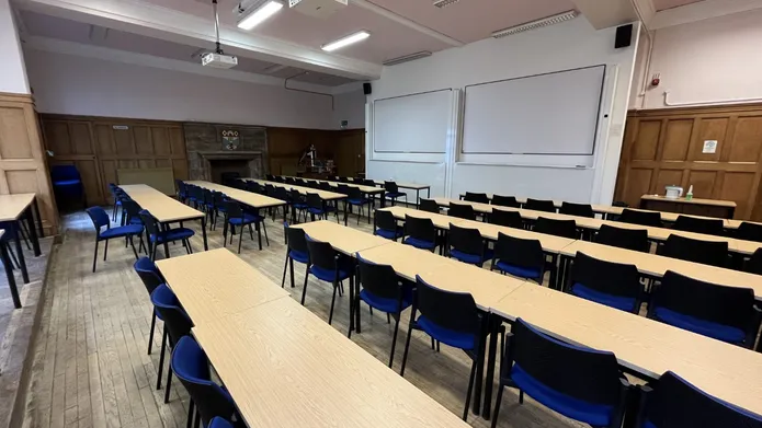 1 Perth Road Accountancy Lecture Theatre with rows of tables and two white screens
