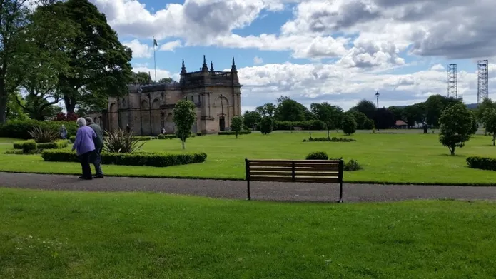 Baxter park with two people walking along a path 