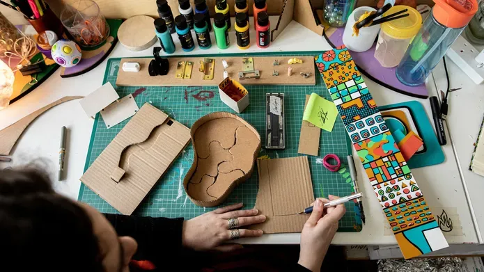 A DJCAD student working on her Degree Show project in the studio. 