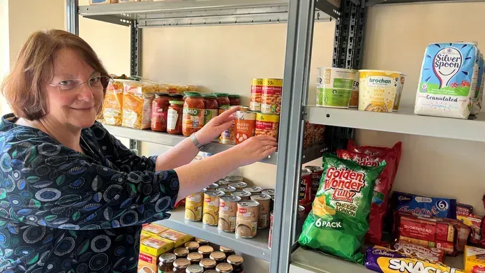 Dr Joan Cameron with items available in the new pantry