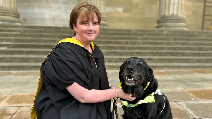 Leanne Moore and her guide dog Wanda posed by the Caird Hall