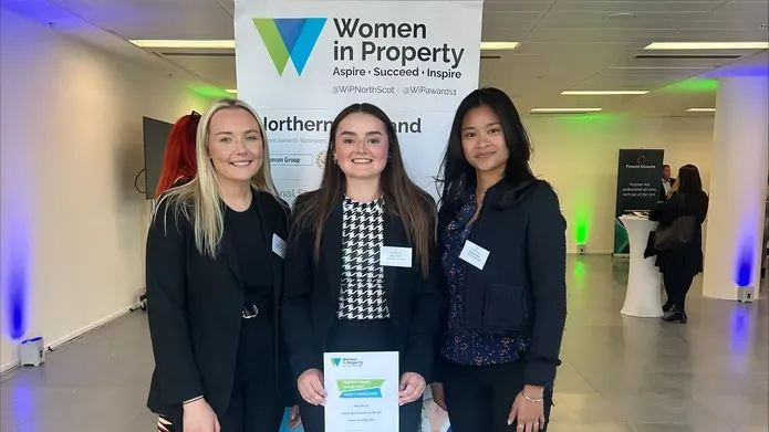 Pictured L to R- Morgan, Amy, Julianne standing in front of Women in Property Awards banner