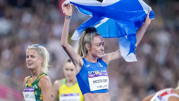 Eilish McColgan celebrate with the Scottish flag after winning the gold medal in the women's 10,000m final during the athletics competition at alexander stadium during the Birmingham 2022 commonwealth games. 
