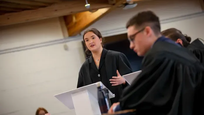 Graduate stood talking at the podium 