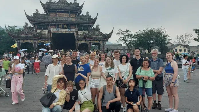 Josh and his exchange student companions pose in front of a Chinese temple